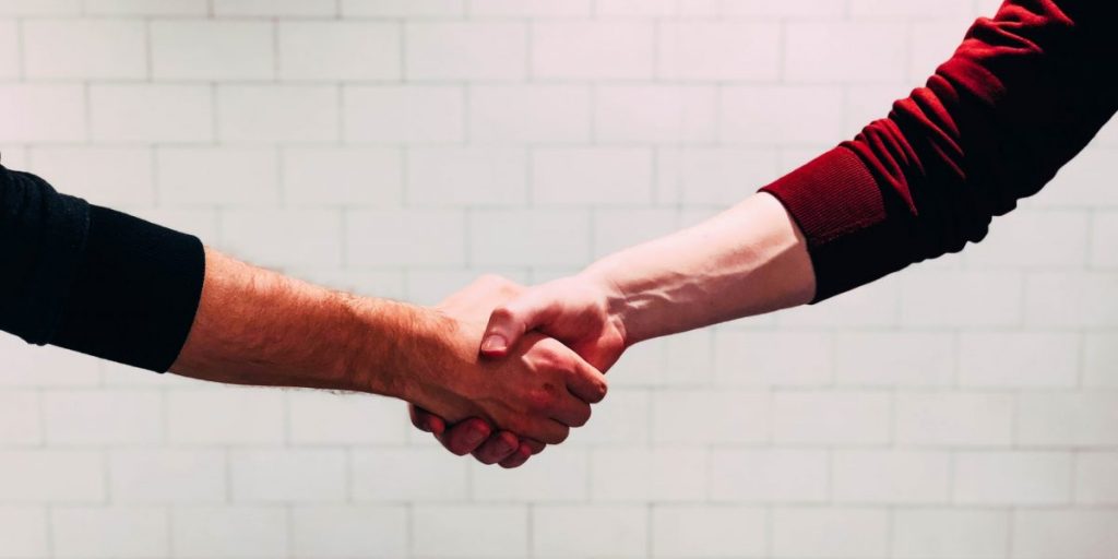 job interview company featured image handshake